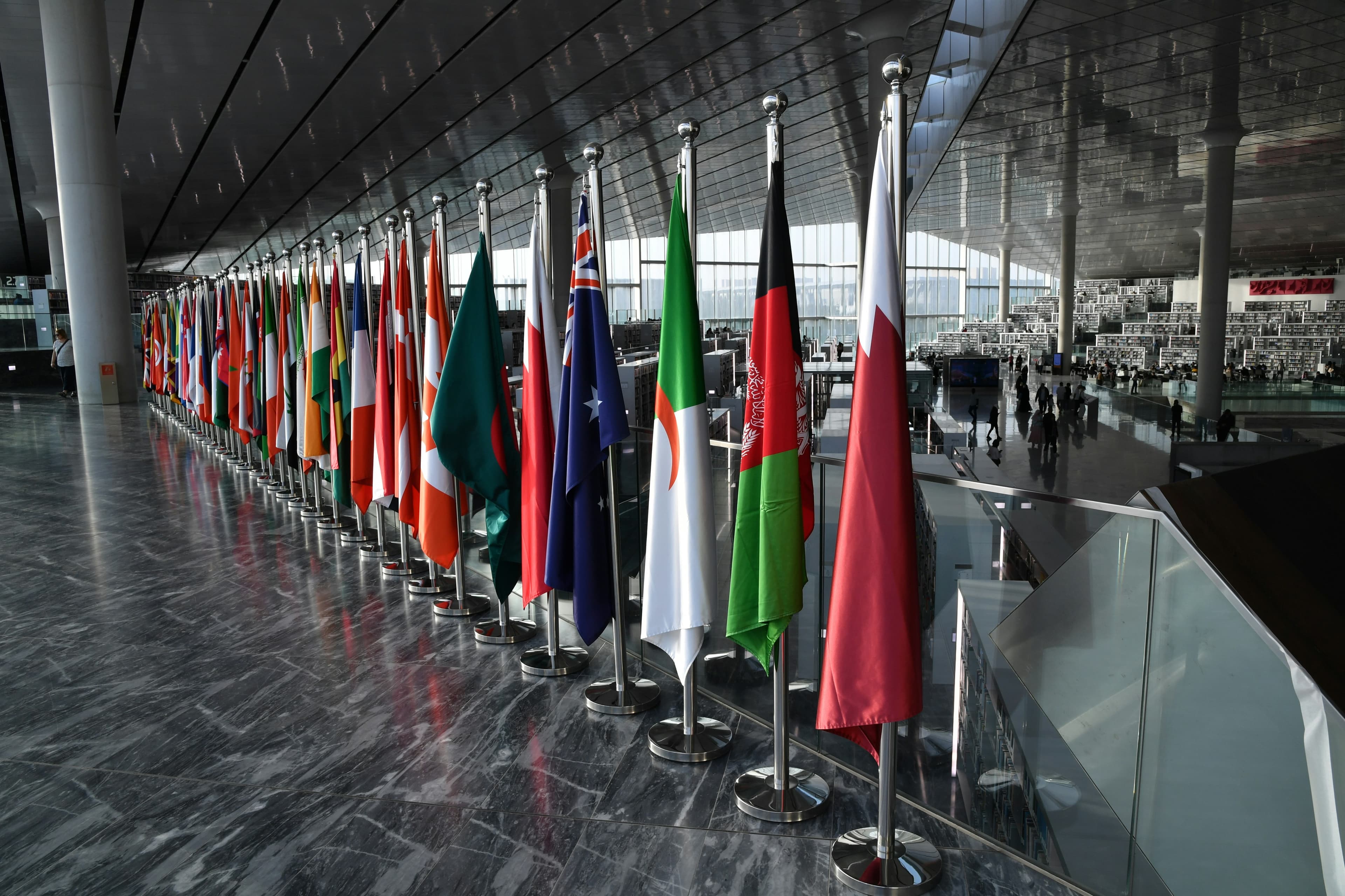A hall of national flags, evoking the international delegations PFIG 27 convenes