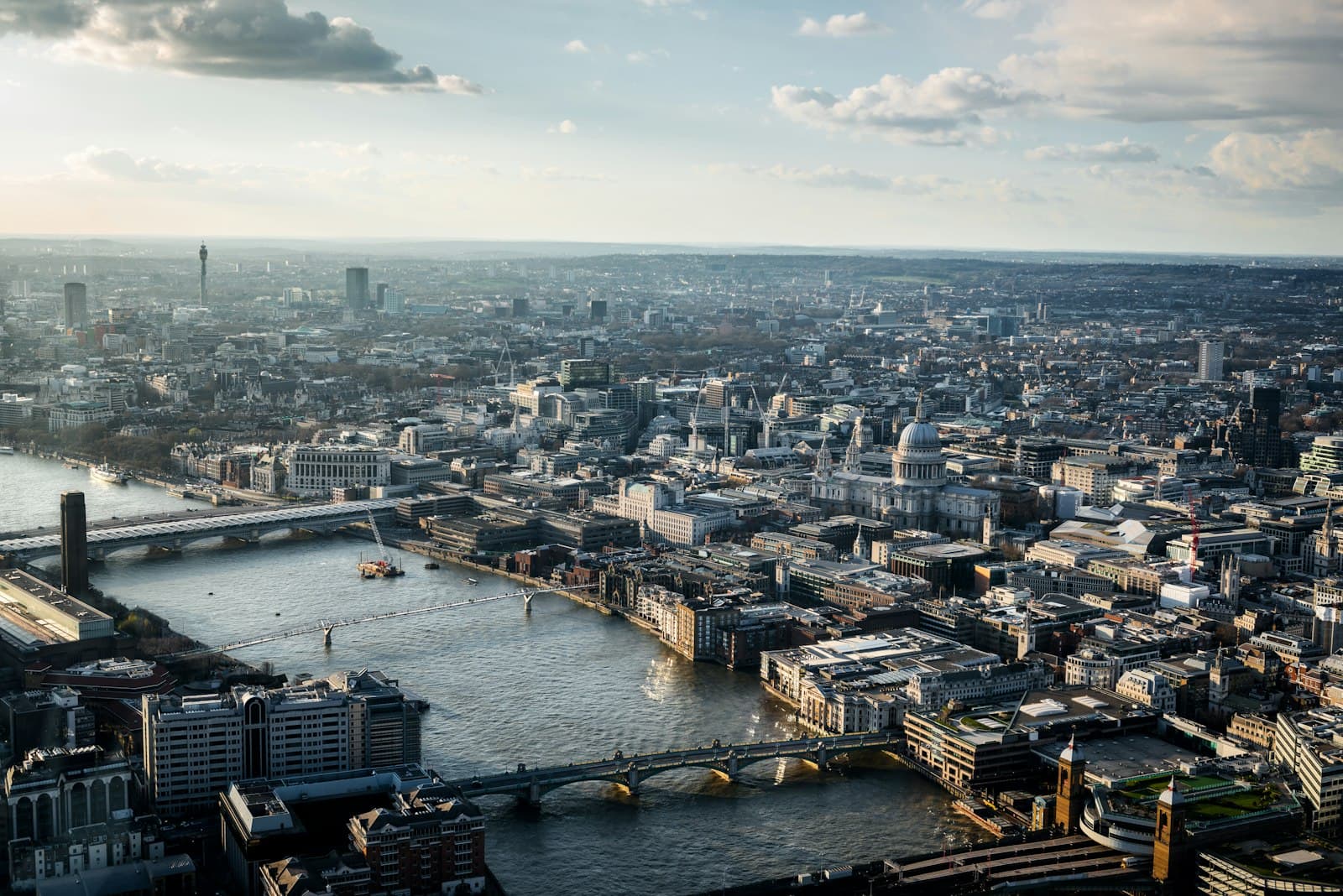 An aerial view of a financial district skyline at dusk