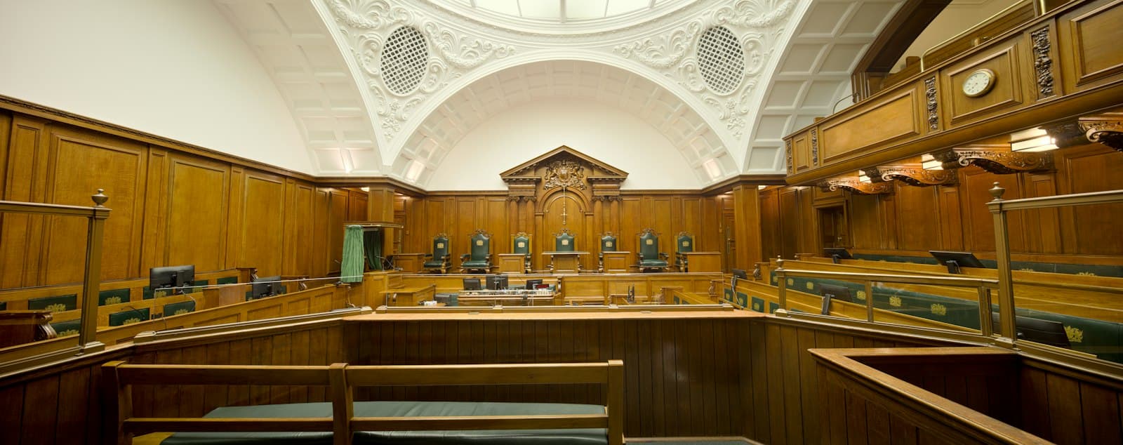 An empty wood-panelled courtroom