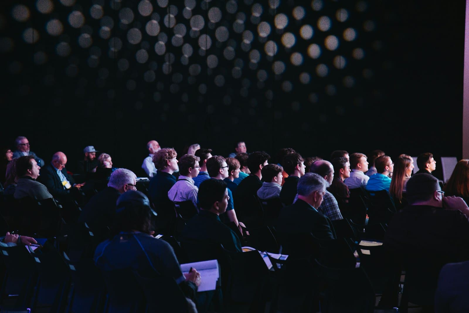 An audience seated at a conference session